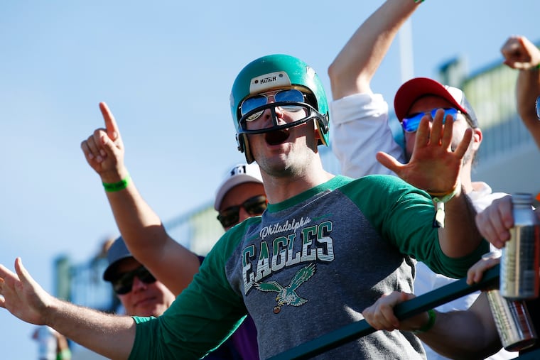 A Philadelphia Eagles fan cheers with other members of the gallery at the 16th hole during the final round of the Waste Management Phoenix Open golf tournament in 2018.