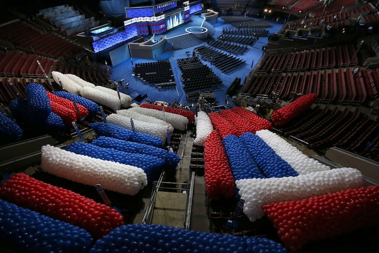 Balloons for the final night of the 2016 Democratic National Convention wait to be lifted to the ceiling during preparations at the Wells Fargo Center.