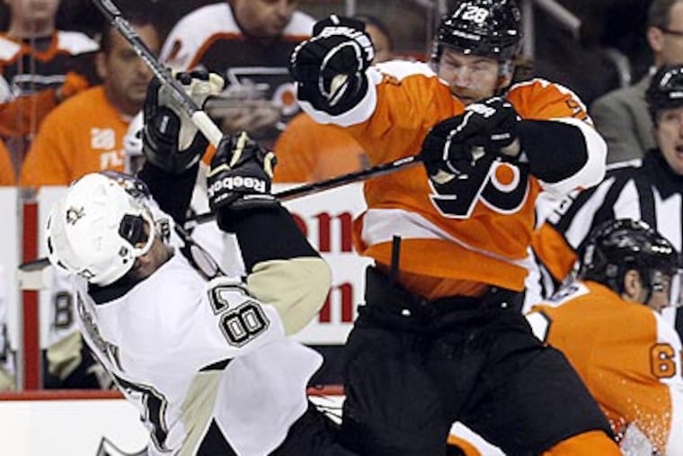 Claude Giroux checks Sidney Crosby just after the opening faceoff of Game 6. (Yong Kim/Staff Photographer)