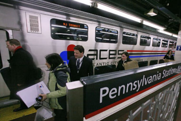 Riders board the new Atlantic City Express Service (ACES) train at Penn Station in New York, on Jan. 30. ACES is a venture of Atlantic City casinos to operate a weekend train service between New York and Atlantic City. (AP Photos / Bebeto Matthews)