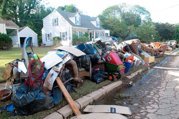 Ruined household possessions are piled at the curb in Manville, N.J., after remnants of Tropical Storm Ida caused massive flooding in the Raritan River town in September 2021.