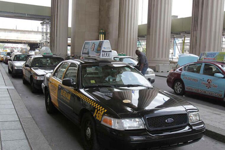 Taxis wait for customers at 30th Street Station. (Akira Suwa / Staff Photographer)