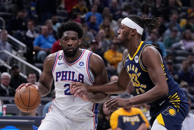 Philadelphia 76ers' Joel Embiid goes to the basket against Indiana Pacers' Myles Turner.