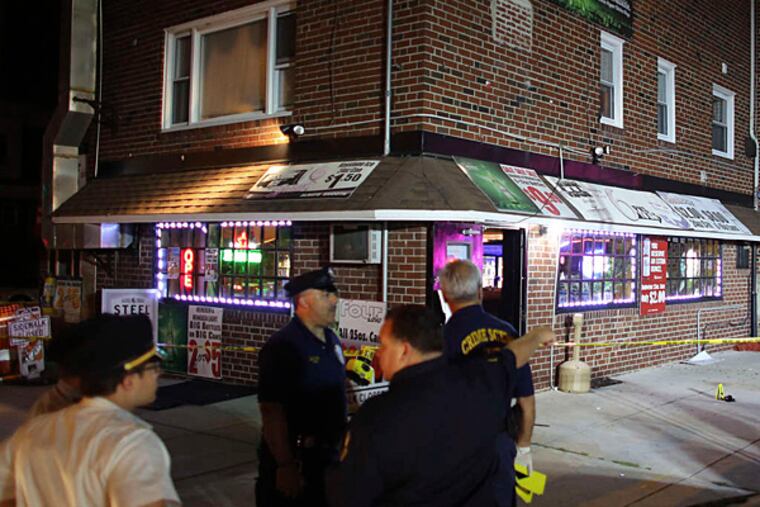 The scene outside the Tangeray Tavern in Summerdale after four people were shot, one fatally.