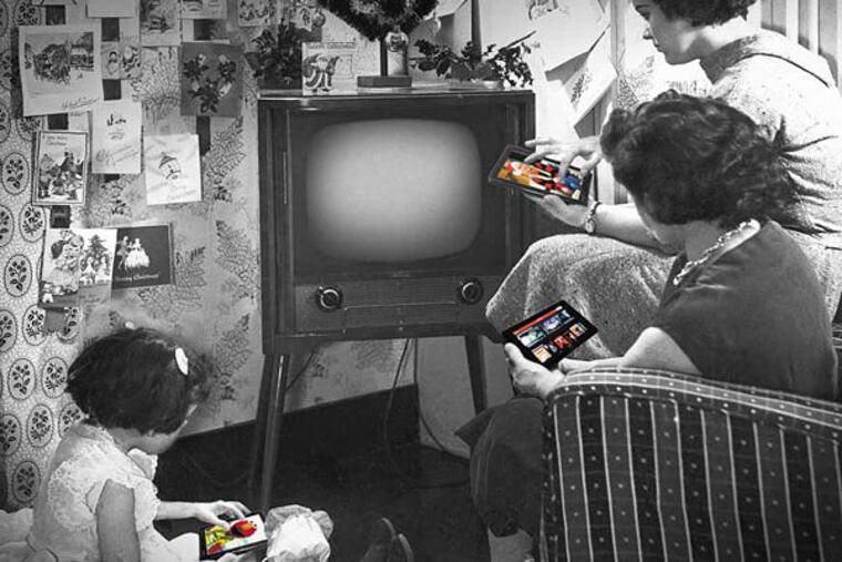 Mrs. Sidney Smart and her daughters, Sandra, 4, and Barbara, 15, look-in as Queen Elizabeth II makes her Christmas broadcast on television on Christmas Day, Dec. 25, 1957. Her Majesty spoke from the long library at Sandringham, and was seen by both B.B.C. and I.T.V. viewers. It was the first time that the occasion has been televised. The Smart family live at Walthamstow, London, United Kingdom. (AP Photo/Sidney Smart; Inquirer photo illustration)