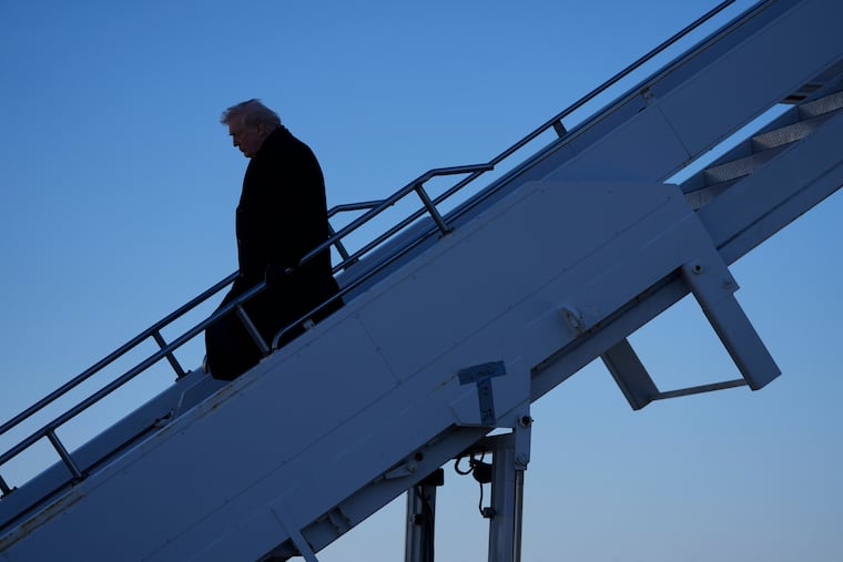 President Donald Trump steps off Air Force One at Des Moines International Airport in Des Moines, Iowa, Tuesday, Jan. 27, 2026. (AP Photo/Mark Schiefelbein)