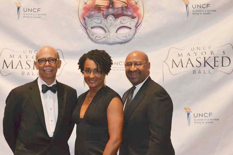 From left to right: Tom Lomax UNCF president stand with Lisa and Mayor Michael Nutter at the UNCF MayorÕs Ball on March 6,2015 at the Pennsylvania Convention Center. (Maggie Henry Corcoran / For the Philadelphia Inquirer)