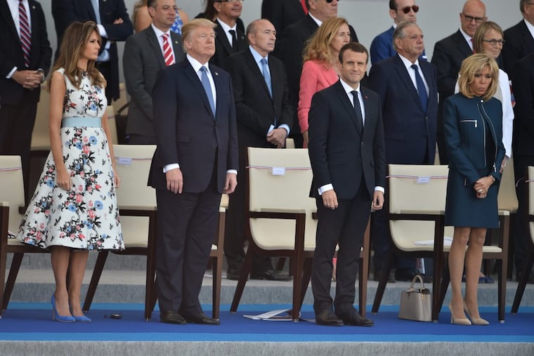 President Donald Trump, first lady Melania Trump and French President Emmanuel Macron with Brigitte Macron attend the annual Bastille Day military parade on the Champs-Elysees avenue in Paris on July 14, 2017.