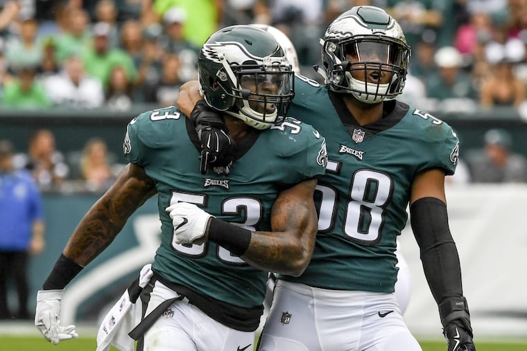 Eagles linebacker Nigel Bradham (left) will take over for injured linebacker Jordan Hicks (right) as the one receiving play calls.