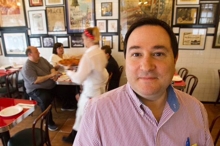 Pennsylvania gaming regulators say Mike Giammarino is unsuitable to operate a restaurant in a casino because of alleged links to organized crime. Giammarino, shown here in 2013 in Gennaro's Tomato Pie in South Philadelphia, is fighting back.