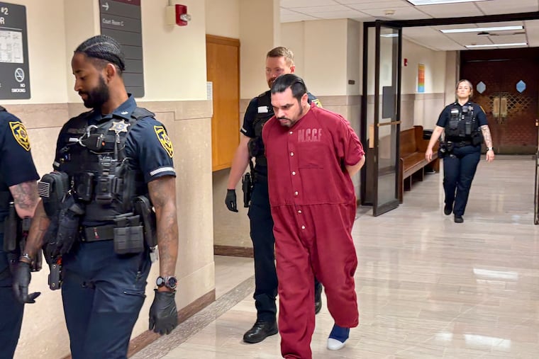 Felix Santos-Colon is escorted from the Montgomery County Courthouse on Friday after pleading guilty to third-degree murder in the death of Oscar Travezio-Tercero.