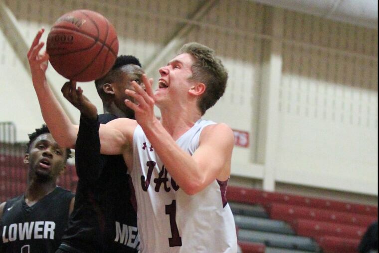 Garnet Valleys Austin Laughlin (1) drives to the basket against Lower Merion.