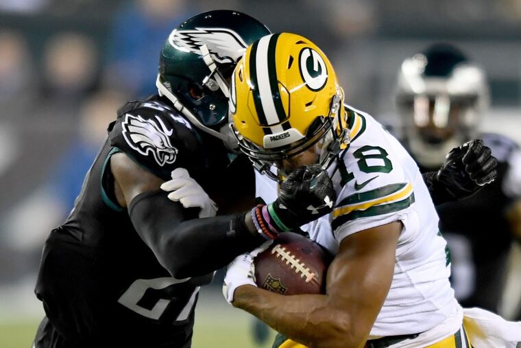 Eagles safety Malcolm Jenkins (left) collides with Packers wide receiver’ Randall Cobb in loss to Green Bay last season.