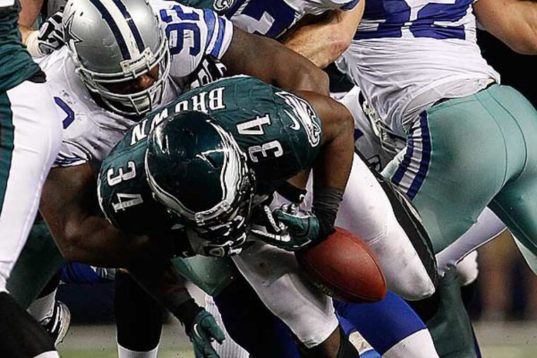 Bryce Brown fumbles the ball on a drive late in the fourth quarter. (David Maialetti/Staff Photographer)