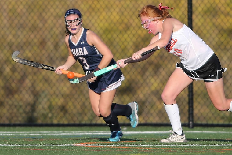 Cardinal O’Hara's Annemarie Banes tries with Archbishop Carroll's Carly Peters for the ball during the second half in Conshohocken, Wednesday, October 21, 2015.