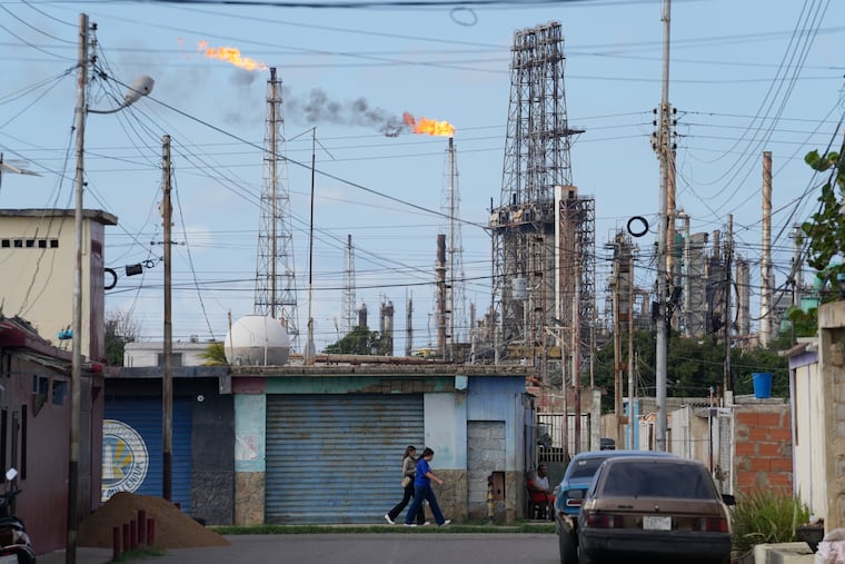 Flames rise from flare stacks at the Amuay refinery in Los Taques, Venezuela, last week.