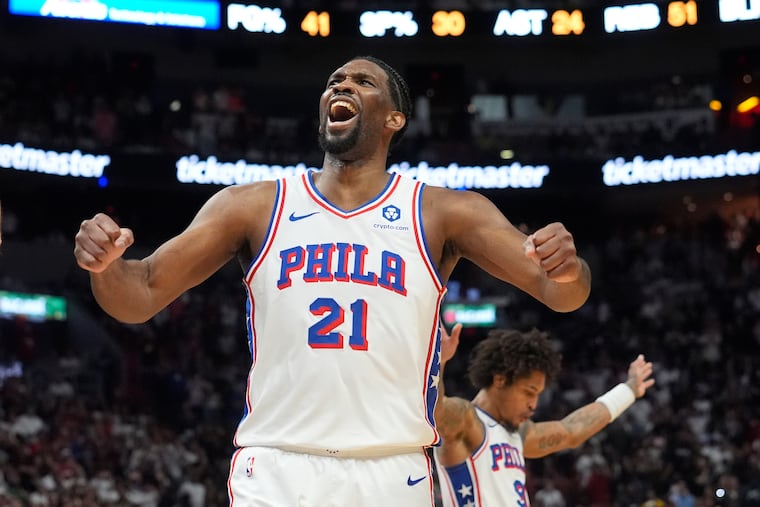Sixers center Joel Embiid (21) celebrates as the team pulls ahead of the Miami Heat during the last minute of the second half of the Sixers' 109-105 win over the Heat on Thursday.