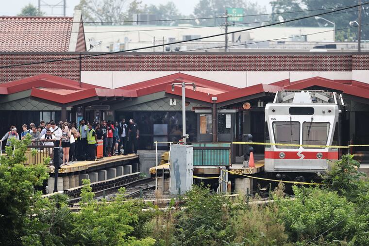 At right is a SEPTA Norristown High Speed Line train being inspected by NTSB and SEPTA after two trains made contact in August 2017.