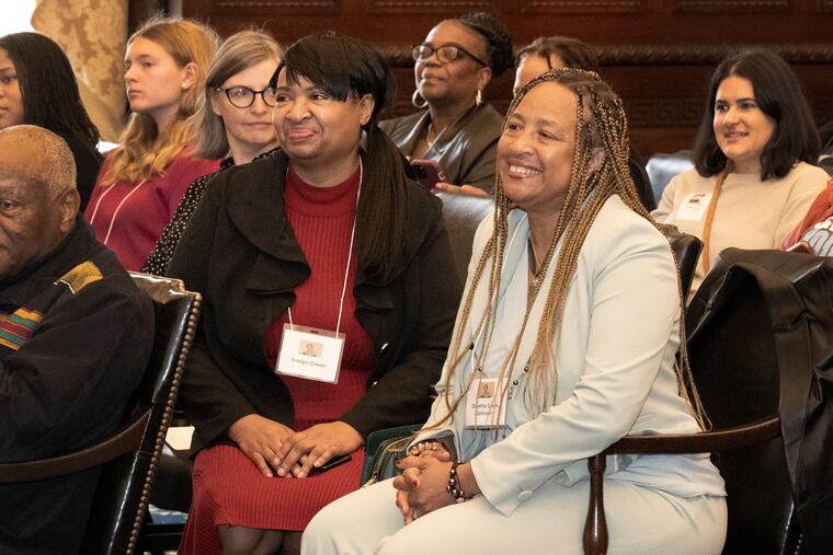 Harriet Tubman's family members, Evelyn Green, left, and Danetta Green Johnson, smile during Alvin Pettit's speech as his winning sculpture of Harriet Tubman was unveiled on Monday, Oct. 30, 2023, at Philadelphia City Hall in Philadelphia. (Jose F. Moreno/The Philadelphia Inquirer via AP)