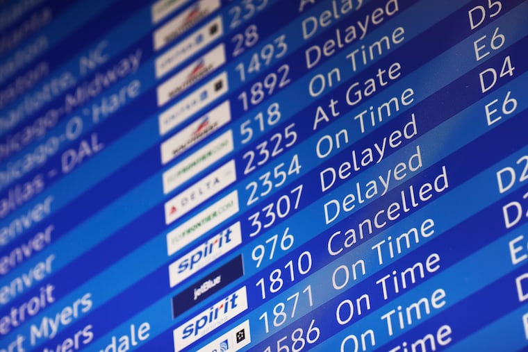 File photo of an arrivals screen at Philadelphia International Airport in Philadelphia in 2021.