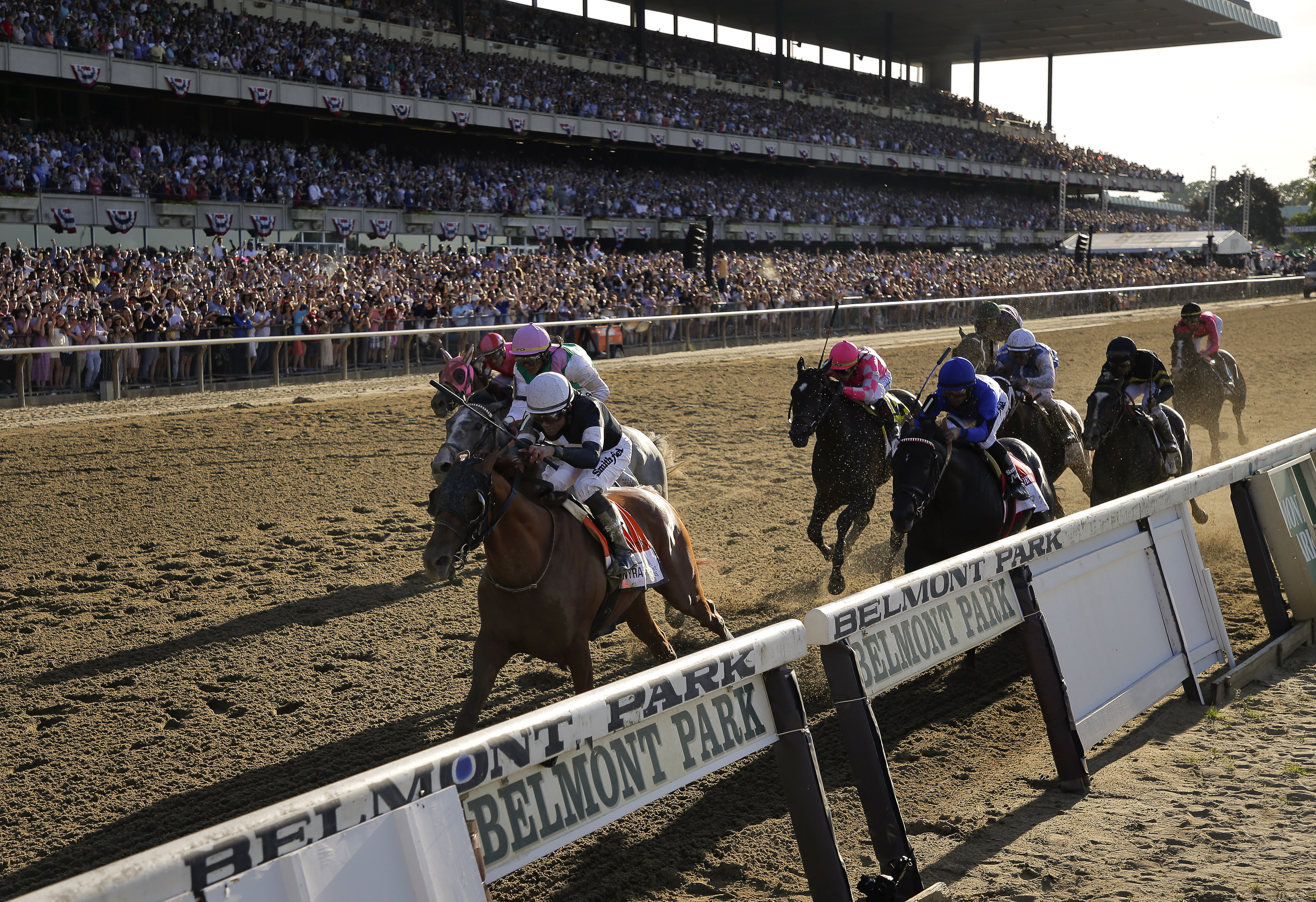 In this June 8, 2019 photo, Sir Winston (7), with jockey Joel Rosario up, crosses the finish line to win the 151st running of the Belmont Stakes.