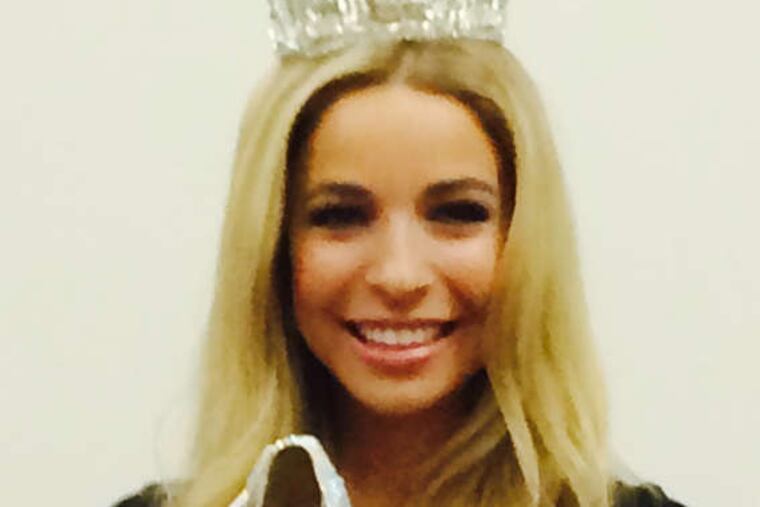 Miss America Kira Kazantsev shows off the shoes she will wear in Saturday's parade on the Boardwalk.