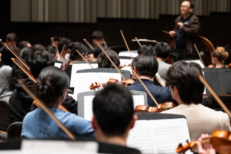 The University of Pennsylvania Symphony Orchestra practices at Irvine Auditorium on Friday evening. The orchestra, founded in 1878, is older than the Philadelphia Symphony Orchestra.