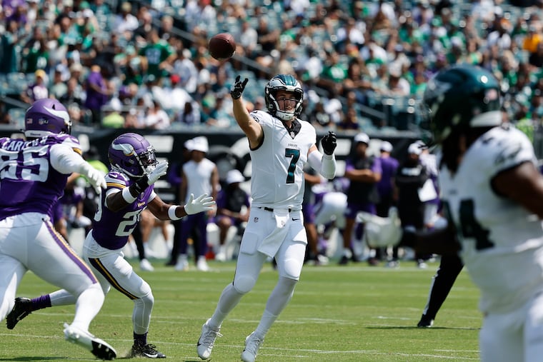 Eagles quarterback Kenny Pickett throws the football away past Minnesota Vikings cornerback Duke Shelley in the second quarter during a preseason game Aug. 24.