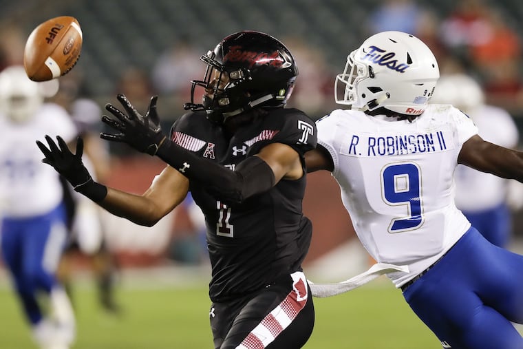 Temple wide receiver Ventell Bryant watches the football against Tulsa cornerback Reggie Robinson II on Thursday, September 20, 2018 in Philadelphia. YONG KIM / Staff Photographer