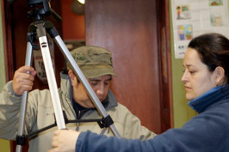 Jose Nicolas and Cecilia Ramirez set up at the Houston Community Center on Snyder Avenue, where video workshops in Spanish have been held.
