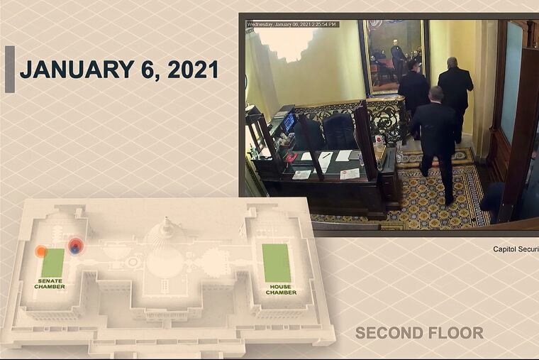 In this image, a security video shows senators leaving the Senate floor as rioters breach the U.S. Capitol. The video was played during the second impeachment trial of former President Donald Trump in the Senate in Washington on Wednesday.