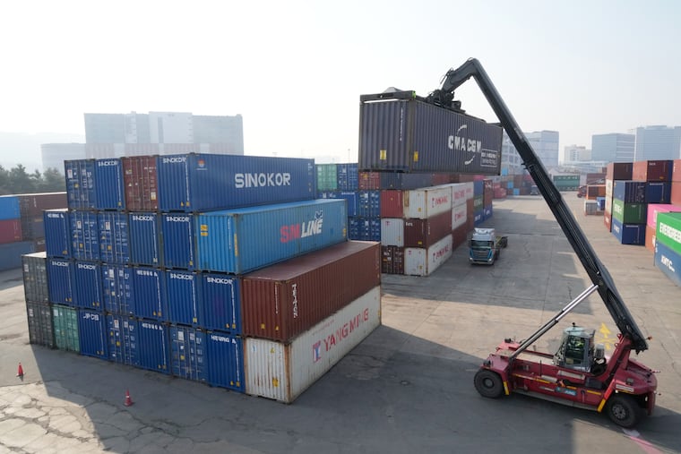 A crane unloads a container at the Uiwang ICD Terminal in Uiwang, South Korea, Thursday, March 12, 2026.