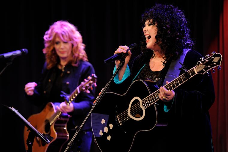 FILE - Nancy Wilson, left, and her sister Ann, of the band Heart, perform during "An Evening with Heart" at the Grammy Museum in Los Angeles on May 24, 2010. Ann Wilson says she has cancer. The band is postponing the remaining shows on its Royal Flush Tour. (AP Photo/Chris Pizzello, File)