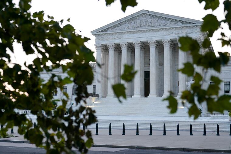 The sun rises behind the Supreme Court in Washington, Wednesday, Sept. 23, 2020, before a private ceremony and public viewing of Justice Ruth Bader Ginsburg.