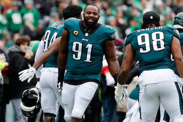 Eagles defensive tackle Fletcher Cox with his teammate during player introductions before the Eagles played the Arizona Cardinals on Dec. 31.