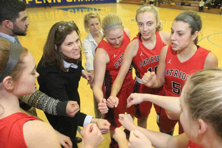 Germantown Academy head coach Sherri Retif huddles the team before the game. (Charles Fox/Staff Photographer)