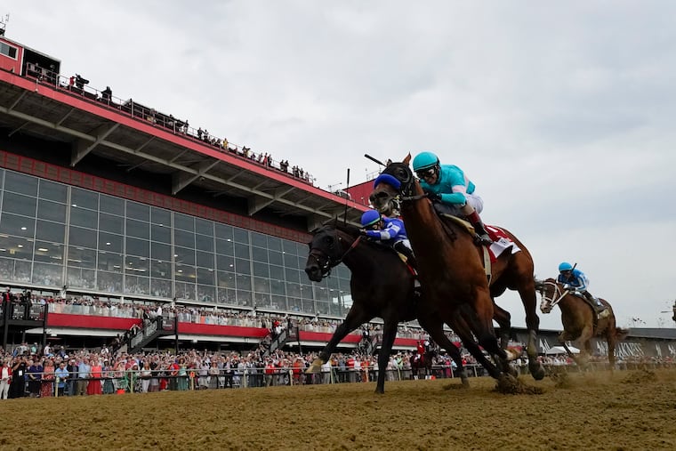 National Treasure, right, with jockey John Velazquez, edging out Blazing Sevens, with jockey Irad Ortiz Jr., to win the148th running of the Preakness Stakes on May 20. National Treasure had 5-1 morning-line odds in the Belmont.