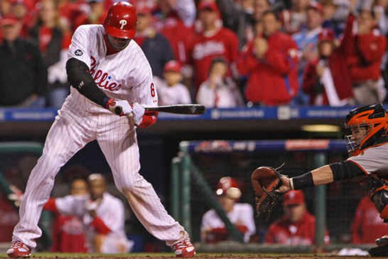 Ryan Howard watches the final pitch of the Phillies' season go by him and into the mitt of Giants catcher Buster Posey. The third strike against Howard stranded two runners and gave San Francisco a 3-2, Game 6 win and the National League pennant.