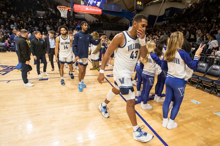 Eric Dixon (right) led Villanova, but the Wildcats are on the outside looking in at the NCAA Tournament for the first time in a long time.