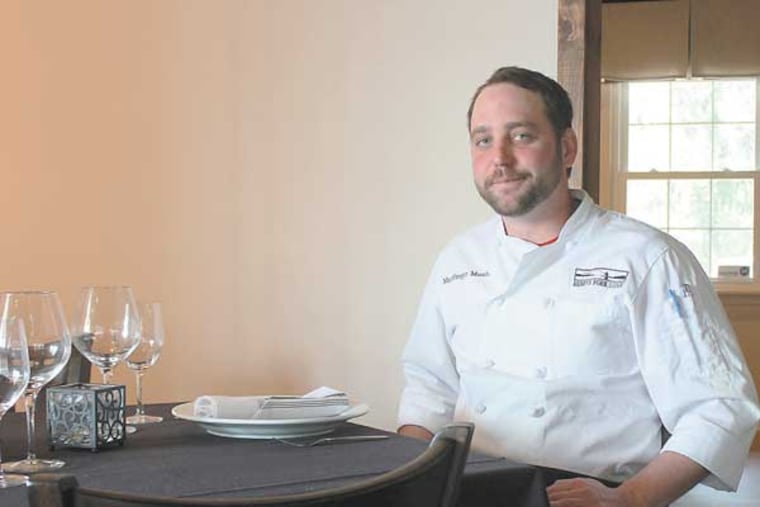 Chef MacGregor Mann in the main dining room of Junto, his new BYOB in Chadds Ford. (MICHAEL KLEIN / Philly.com)