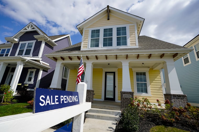 A “sale pending” sign is posted on a home in Westfield, Ind., in 2020.