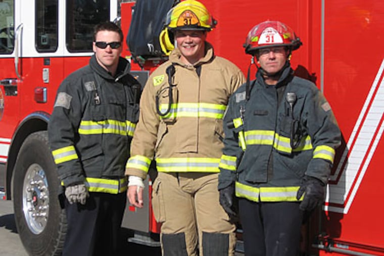 Danny Watkins (center) with fellow firefighters Richard Bwiss (left) and Capt. Lionel Bateman. (Photo courtesy Capt. Lionel Bateman)