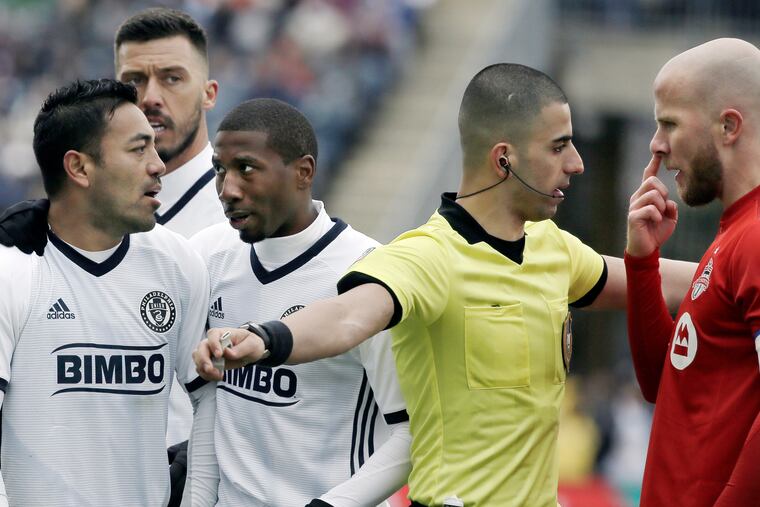 Michael Bradley (right) scored two goals in Toronto FC's 3-1 win over the Philadelphia Union. Haris Medunjanin (second from left) had a front-row view of both of them.
