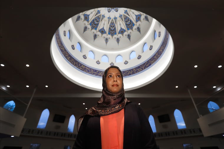 Hind Makki, poses for a portrait at the The Prayer Center of Orland Park in Orland Park, Ill. Makki remembers how, as a young girl, she would call out others at the Islamic school she attended when she heard an Arabic word that means "slave" casually used to refer to Black people. "Maybe 85% of the time, the response I would get from people...is 'Oh, we don't mean you, we mean the Americans,'" Makki said.