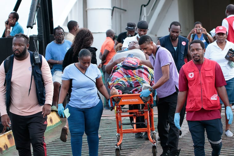 Members of the Red Cross transport a Union Island evacuee on a stretcher as she arrives in Kingstown, St. Vincent and the Grenadines, on Wednesday, July 3, 2024. The island, in the Grenadines archipelago, was hit by Hurricane Beryl.