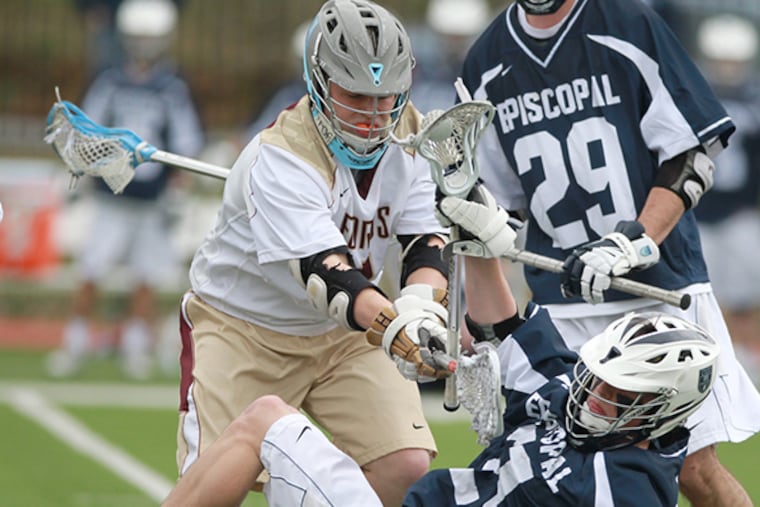 Brian Casey, left, of the Haverford School knocks Gavin Chambers, center, of Episcopal Academy to the ground during the 2nd quarter of a Inter-Ac lacrosse game on April 7, 2015. (Charles Fox/Staff Photographer)