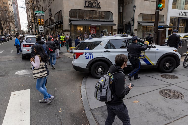 Philadelphia police investigate a shooting near the intersection of 17th and Chestnut Street in Center City Philadelphia on Thursday.