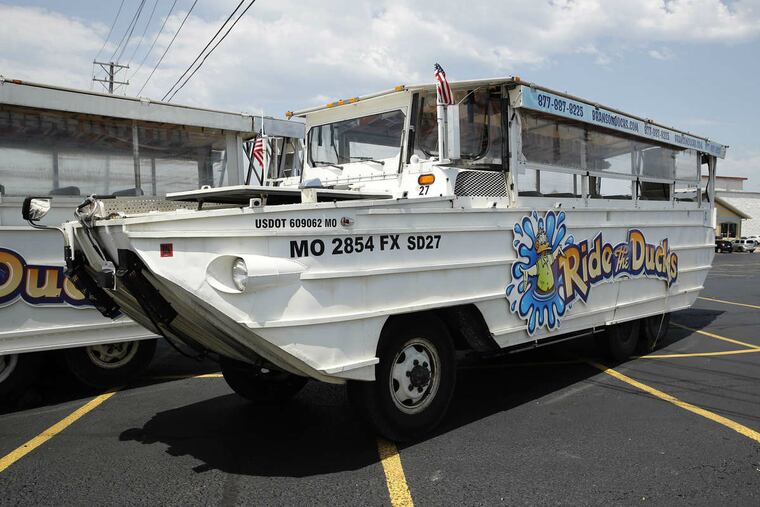 In this July 20, 2018, file photo, a duck boat sits idle in a parking lot in Branson, Mo.