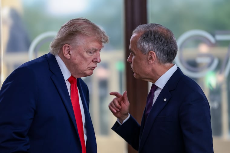 President Donald Trump speaks with Canadian Prime Minister Mark Carney at a working lunch with leaders of the G7 and the Middle East in Evian-les-Bains, France, in June.