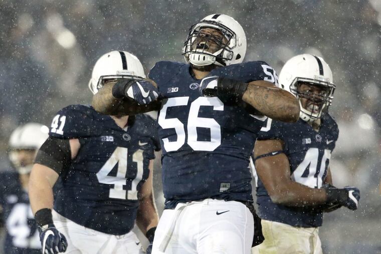Tyrell Chavis (56) celebrates a sack against Nebraska last Saturday. Nittany Lions coach James Franklin calls Chavis “a bright light. He is positive energy. He is amazing.” (AP Photo/Chris Knight)
